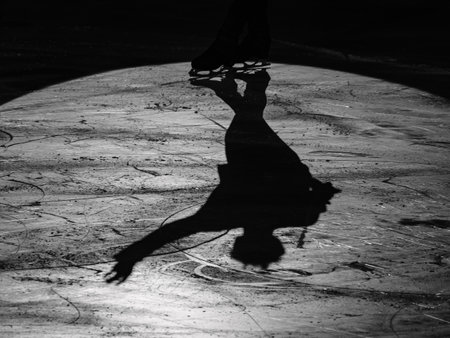 Shadow of an Athlete Skater reflected on the Ice Rink during the Artistic and Technical performance.の写真素材