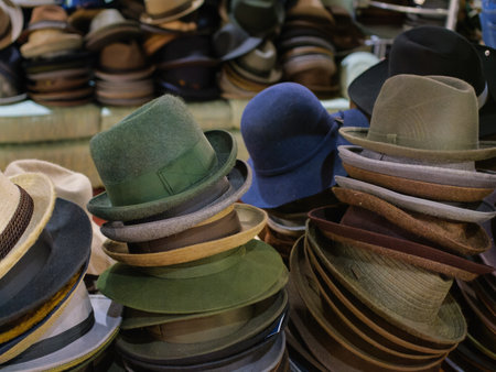 Collection of Various Hats Arranged on Surface in a Market Setting.の写真素材