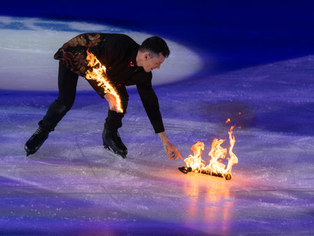 Skater collecting Sticks from Ice Rink.の写真素材