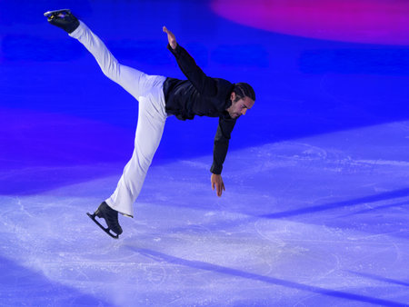 Skater performing a Jump and Artistic and Technical performance on the Ice Rink.の写真素材
