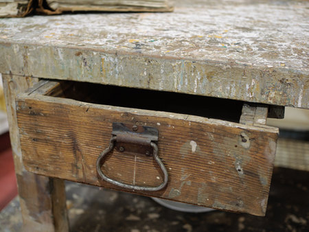 Rustic Wooden Table with Exposed Drawer and Metal Ring.の写真素材