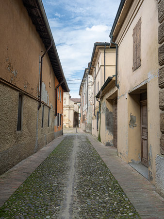 Ancient Cobblestone Street Between Historic Buildings In Sabbioneta - Mantua, Italy.の写真素材