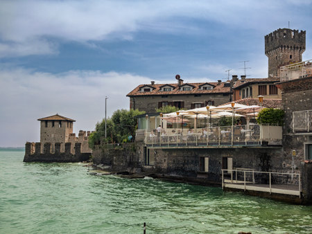 Lake Garda Shoreline and Waterfront Restaurants near Scaligero Castle Sirmione, Italy.の写真素材