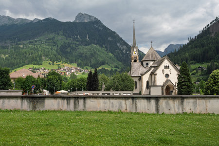 The Historic Church Of Moena And Surrounding Landscape, Italy.の写真素材
