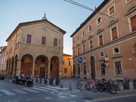 Historic Street Corner with Bicycles and Arched Building - Bologna, Italy.の写真素材