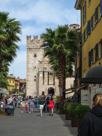Tourists Walking Towards Medieval Fortress in Sirmione, Italy.の写真素材