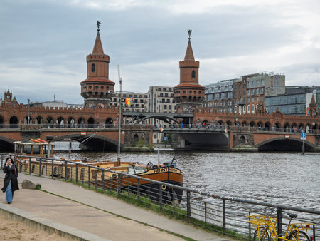 Iconic Oberbaum Bridge In Berlin, Historic Gothic Revival Architecture Spanning Urban Roadway.の写真素材