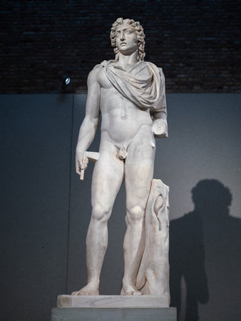 Classic Marble Statue of Helios in Berlin Museum Exhibit Room Spotlight, Germany.