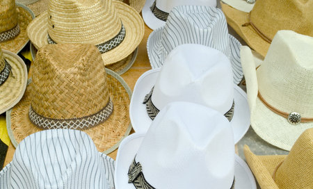 summer hats of various models on displayの写真素材