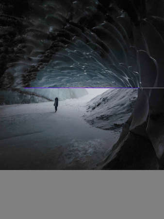 Alaska glacier cave in the middle of mountains on a snowstorm day