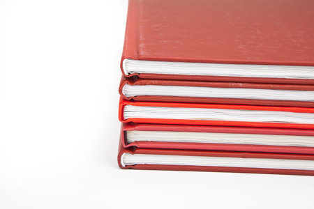 several red books on a white backgroundの写真素材