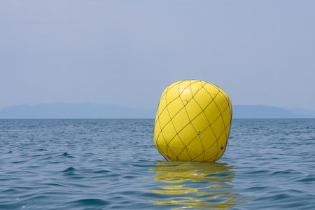 Yellow buoy upwind ready for the raceの写真素材
