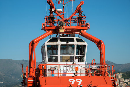cleaning windows of the cockpit of the tug