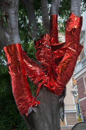 tree covered with red paperの写真素材