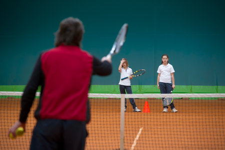 Children at school during a dribble of tennisの写真素材