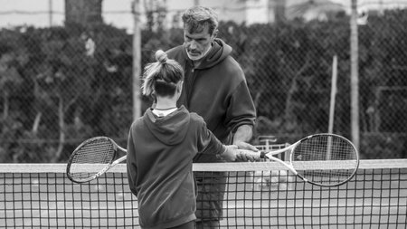 Children at school during a dribble of tennisの写真素材