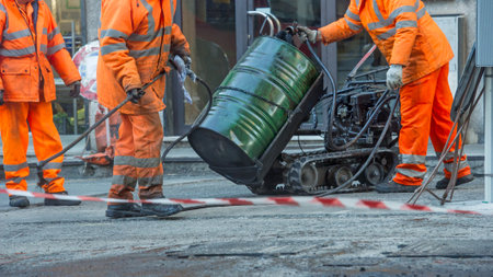 Man 's work in road resurfacing in the city