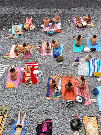TAKE THE SUN ON THE BEACH IN LIGURIA, ITALY.のeditorial素材