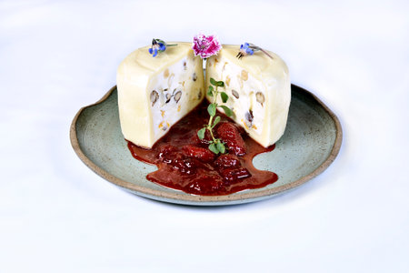 mozzarella cheese stuffed with nuts cut in half with strawberry jam