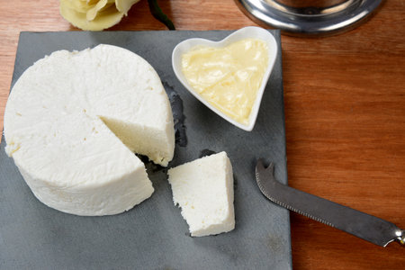 cup of tea with cheese on wooden table, brazilian breakfast