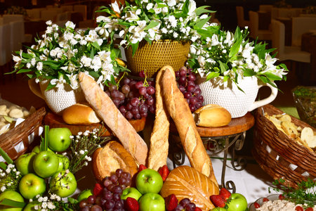 Composition with groceries in wicker basket on kitchen tableの写真素材