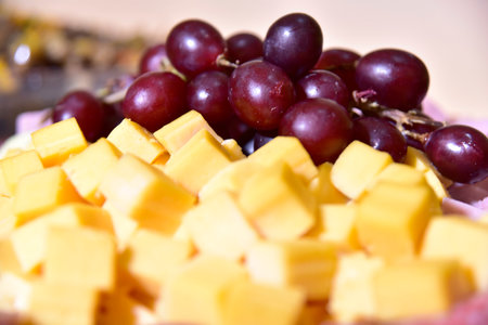 plate with ham cheese grapes antipasto pepperoniの写真素材