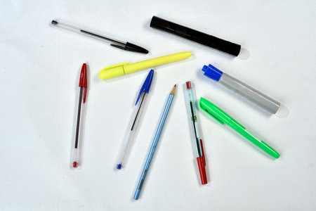 colorful ballpoint pens on white background