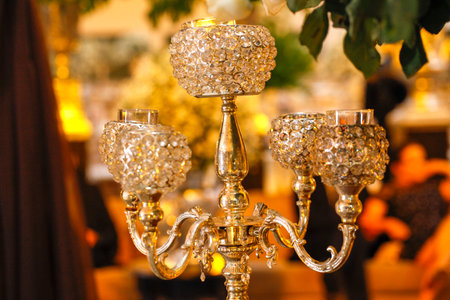 light chandeliers and decorative candles on defocused backgroundの写真素材