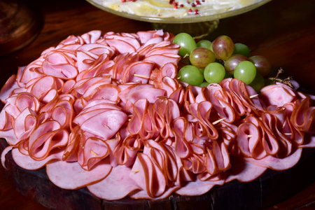 delicious and tasty smoked ham and sliced â€‹â€‹parma ham served on the table with side...