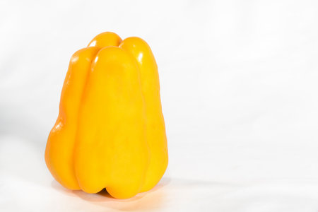 natural yellow and red pepper isolated on White backgroundの写真素材