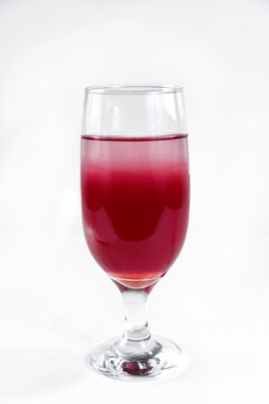delicious tropical drink refreshing red fruit mix isolated on white backgroundの写真素材