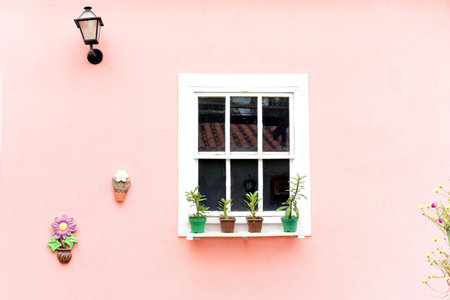 beautiful white window with flower jars and pink wall, passionate, romanticの写真素材