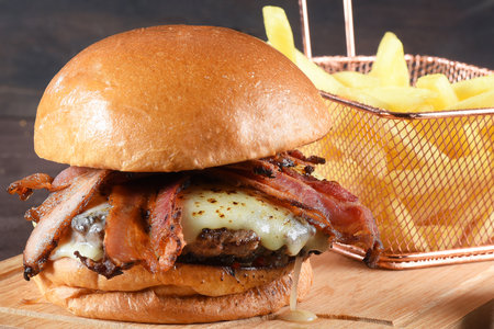 beef hamburger sandwich with brioche bun cheese and french fries.の写真素材
