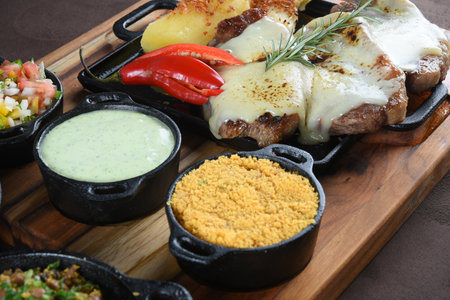 barbecue roast beef with rice, boiled cassava salad, farofa and beans, typical Brazilian cuisineの写真素材
