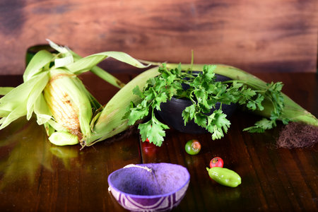 pequi fruit typical Brazilian food, okra seasonings, salad and melted cheese au gratin on blurred backgroundの写真素材