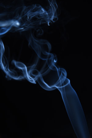 white smoke isolated on black background ideal for texture backgroundの写真素材