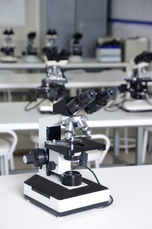 microscope is an optical instrument capable of enlarging images of very small objects, analyzing diseases clinical health research laboratoryの写真素材