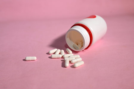 medicine pills isolated on pink backgroundの写真素材