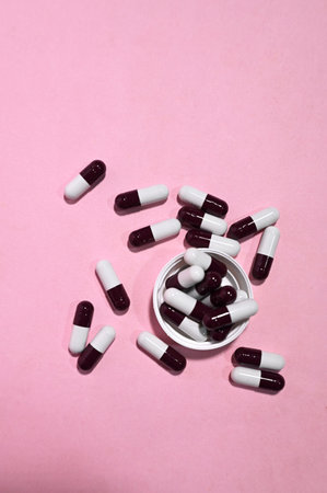 medicine pills isolated on pink backgroundの写真素材