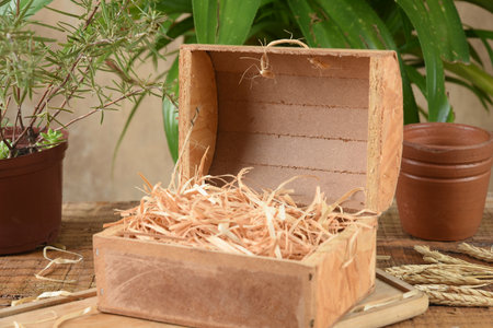 old wooden chest with dry straw inside ideal for assembly