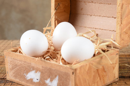 natural chicken egg on the wooden table, rustic free-range chicken natural farm foodの写真素材