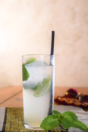 Refreshing summer mojito cocktail with ice and mint Tropical lemonade, grapefruit, pear and berries.の写真素材