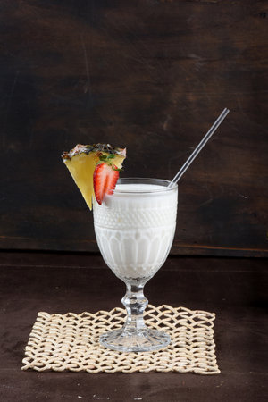 TROPICAL COCONUT AND PINEAPPLE DRINK FRUIT REFRESHING NATURAL SALABLE DRINKの写真素材