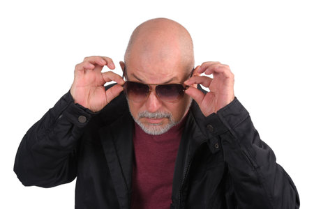 adult man bald white beard with winter cold sweater with stylish sunglassesの写真素材