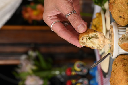Fried codfish fritter typical Portuguese and Brazilian cuisine fish with herbsの写真素材