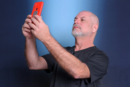 adult man using cell phone communication technology use S3niorLife