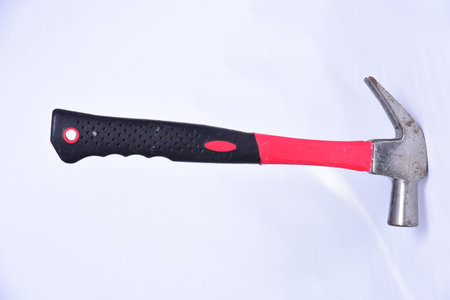 iron hammer with injected plastic handle construction tool hammering nail nailing wood carpentry and constructionの写真素材