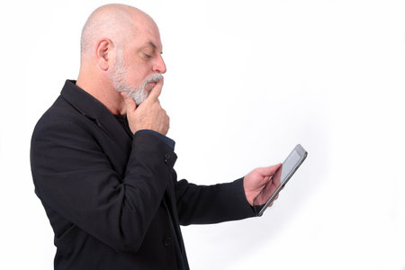 adult man using SeniorLife tablet notebook cell phone communication technology