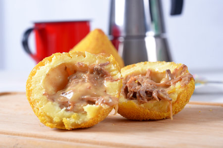 Coxinha traditional brazilian snack Chicken coxinha. potato dumpling stuffed with chicken and dried...