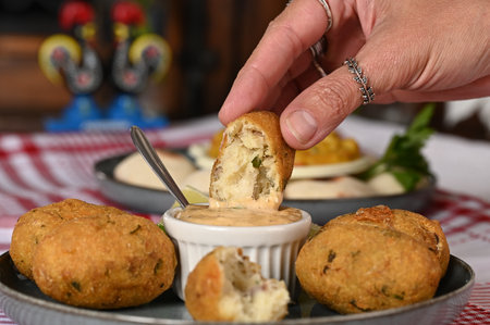 Fried codfish fritter typical Portuguese and Brazilian cuisine fish with herbs food delicios